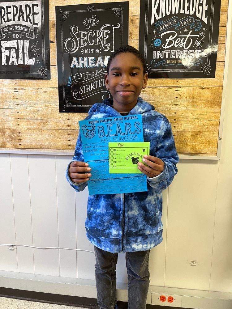 student holding certificate