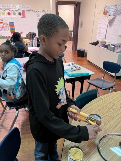 student opening a can