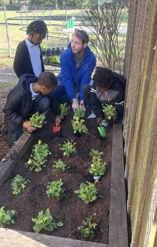 students planting 