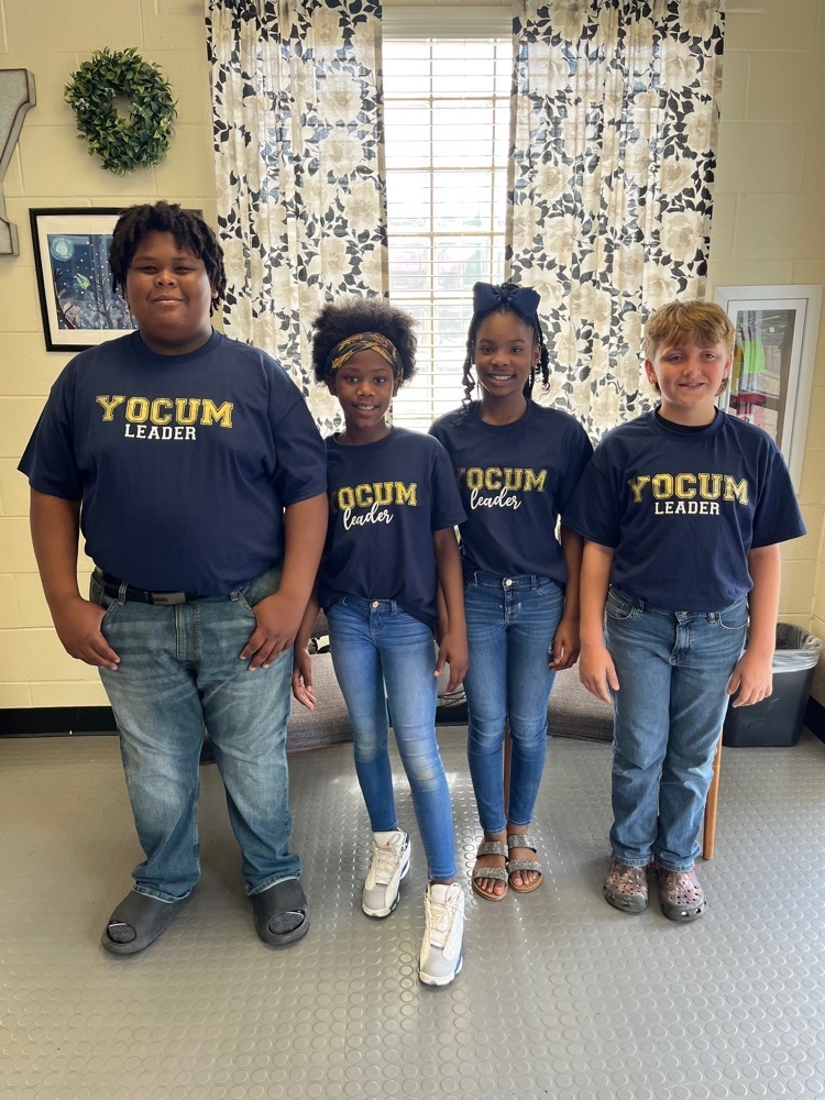 four students in matching Yocum shirts