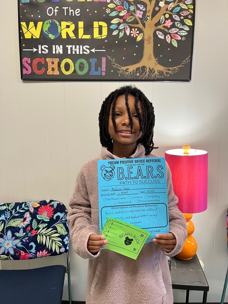student holding paper