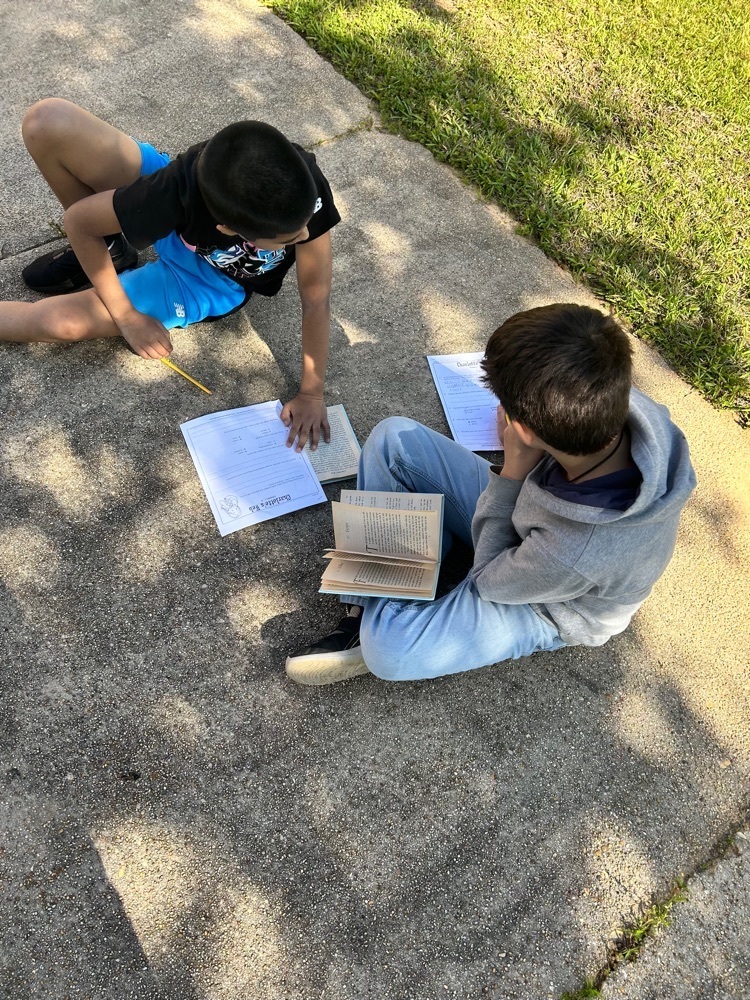 kids on the ground reading